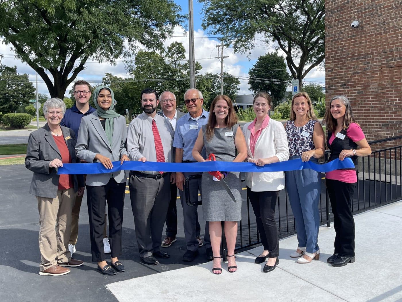 Clearbrook representatives stand with mayor of Rolling Meadows to cut ribbon in front of new facility.