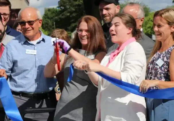 Close-up of Clearbrook representatives cutting ribbon