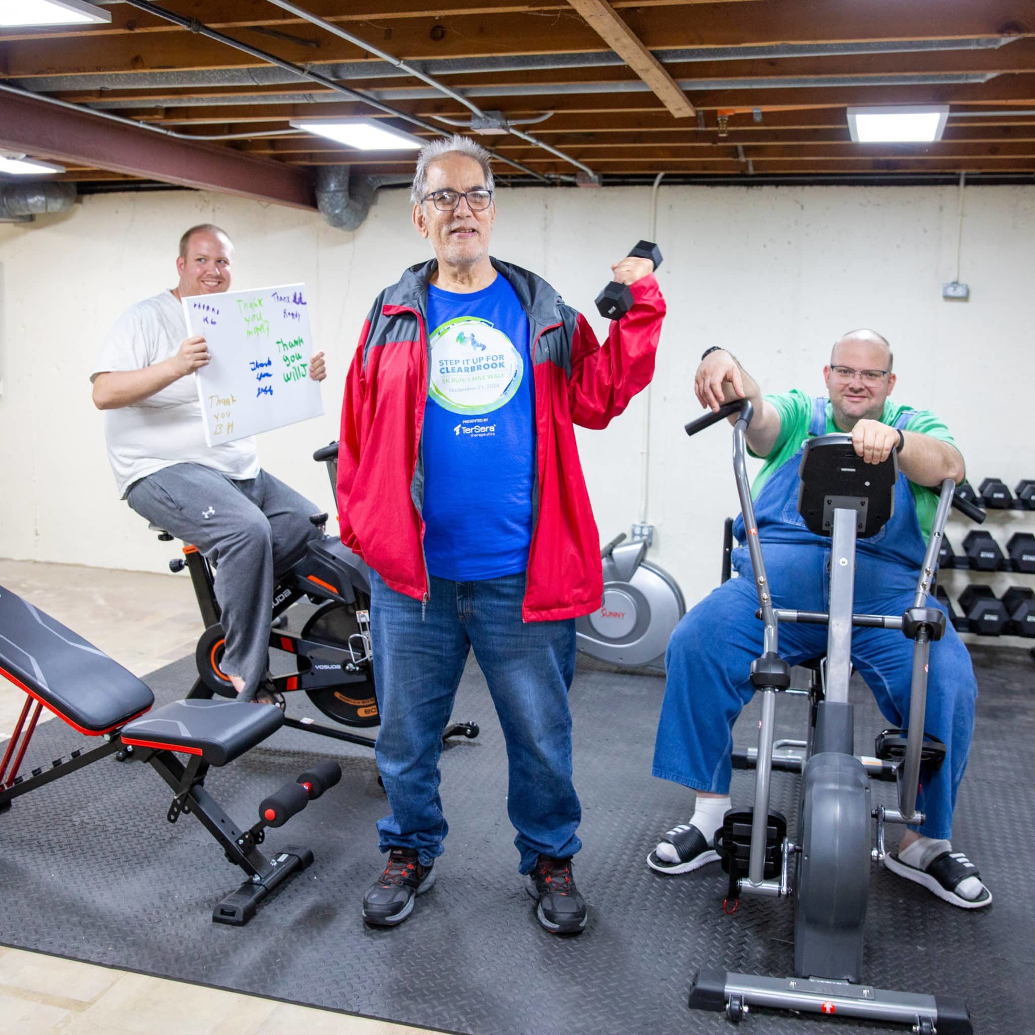 Will, Bryan, and Matt (left to right) in their home gym